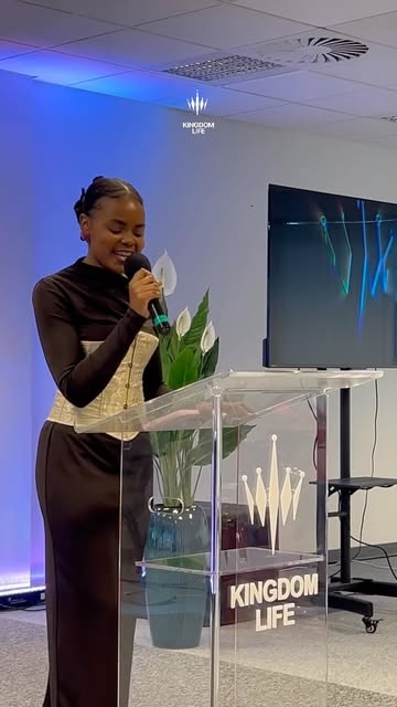 A woman speaking at the Kingdom Life lectern