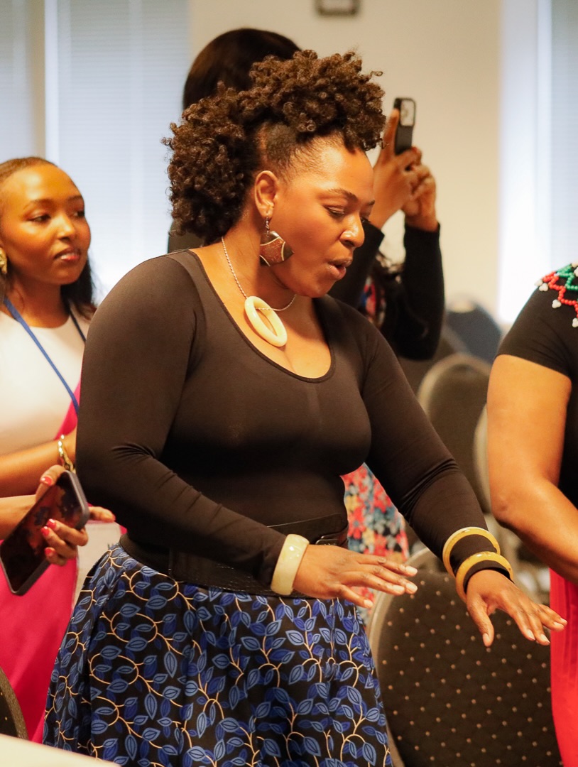 A woman worshiping with outstretched hands